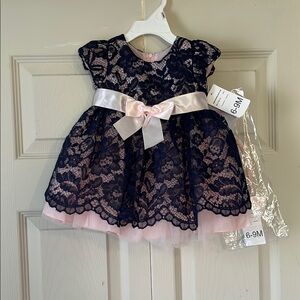 baby girl party or special occasion dress with navy blue lace over pink fabric